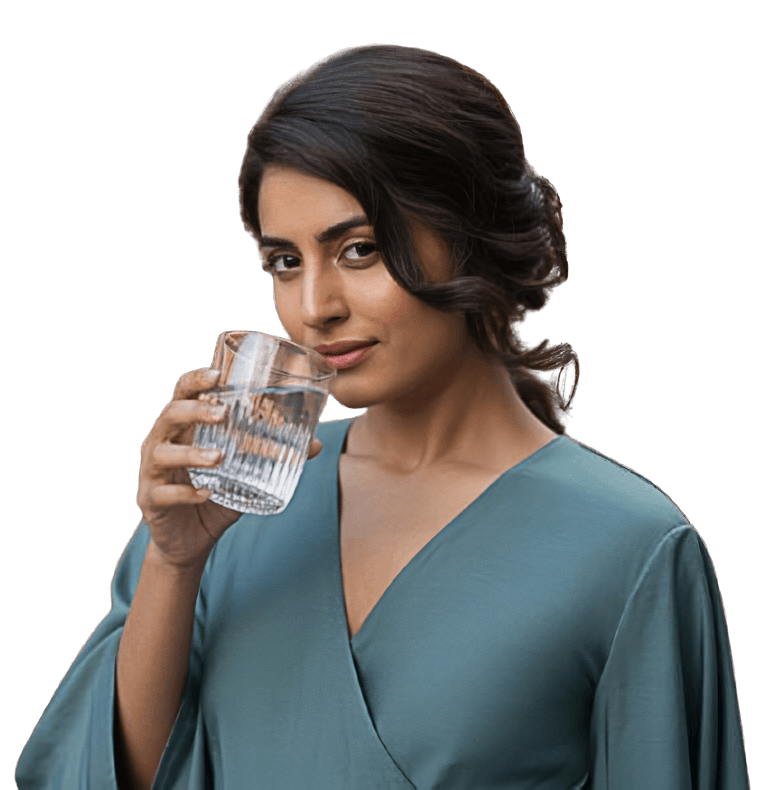 Woman holding a clean glass of water